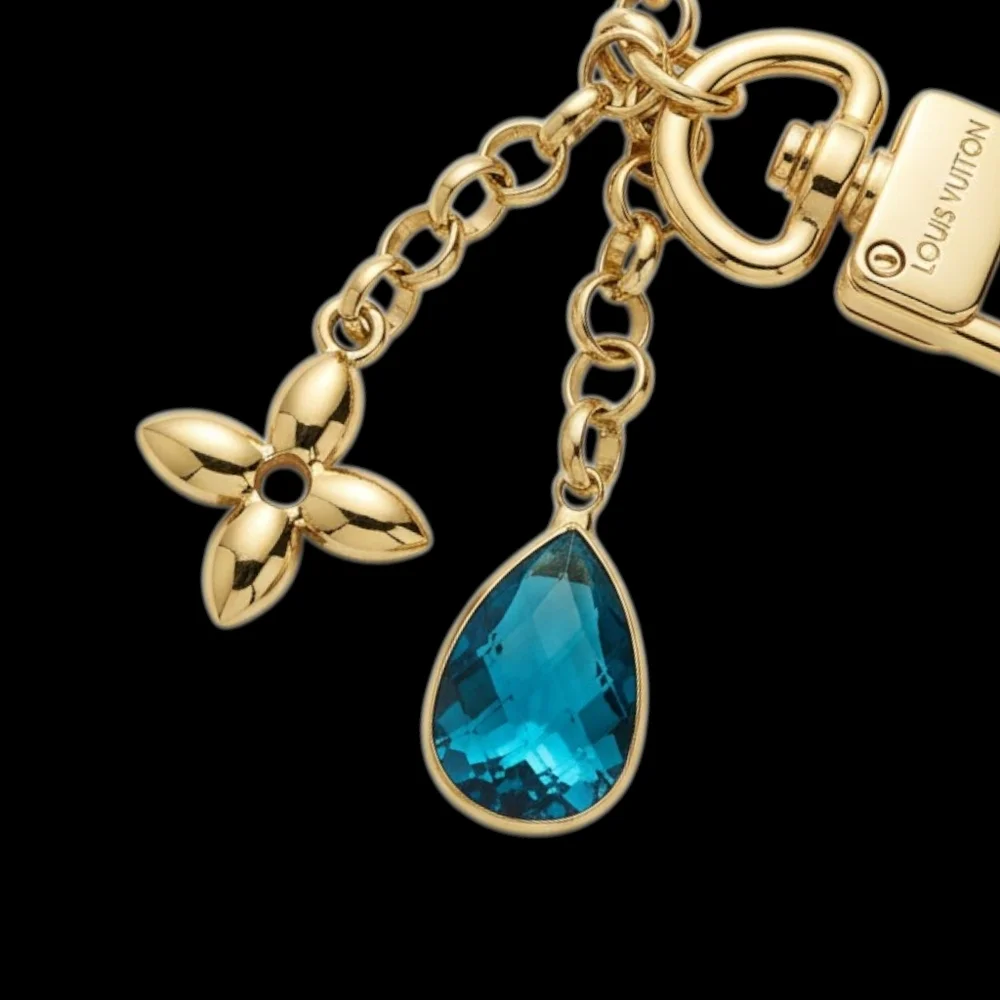 Elegant Gold Bag Chain/Charm with Blue Accent